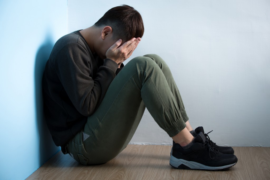depression man sit on floor
